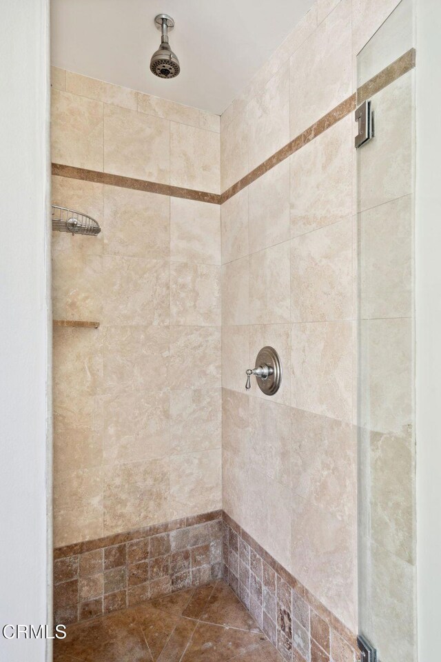 bathroom with a tile shower