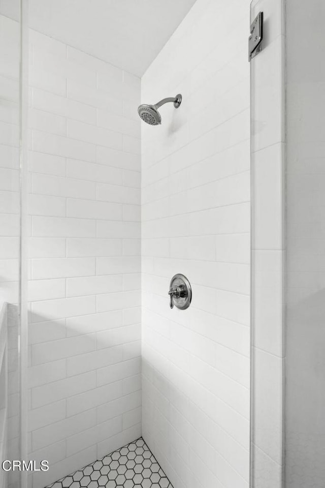 bathroom with a tile shower