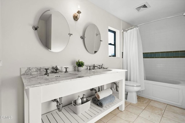 full bathroom with tile patterned floors, toilet, vanity, and shower / bath combo