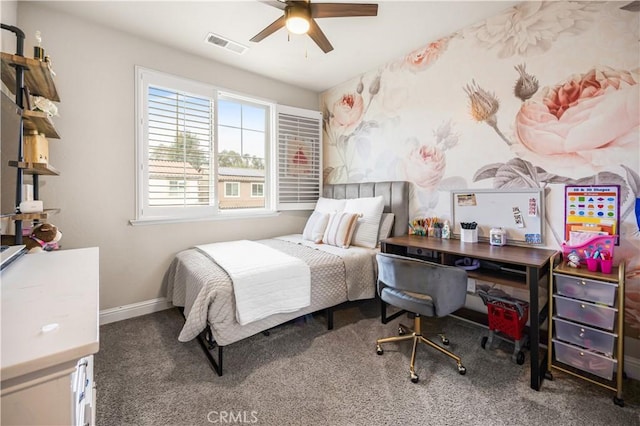 bedroom featuring ceiling fan and dark colored carpet