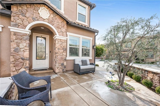 doorway to property with a patio