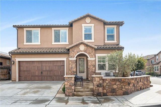 mediterranean / spanish-style home featuring a garage