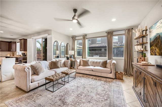 tiled living room with ceiling fan