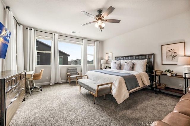 bedroom with ceiling fan and carpet floors