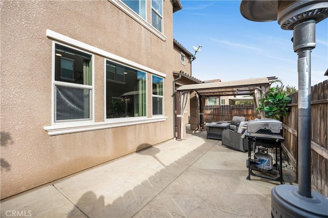 view of patio / terrace featuring a grill, a gazebo, and an outdoor hangout area