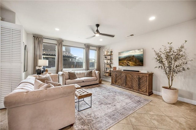 living room featuring ceiling fan and light tile patterned floors