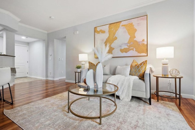 living room featuring ornamental molding and hardwood / wood-style floors