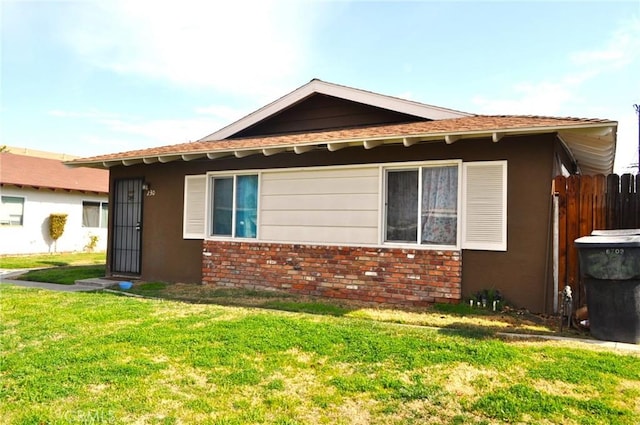 view of side of home featuring a yard