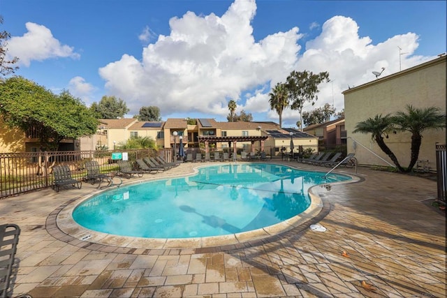 view of swimming pool with a patio area