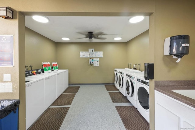 washroom with washing machine and dryer, ceiling fan, and electric panel