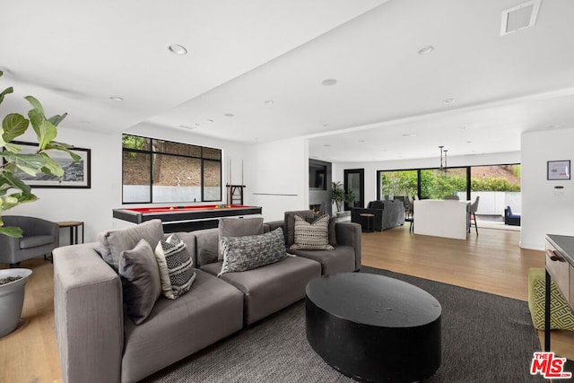 living room featuring billiards and hardwood / wood-style floors