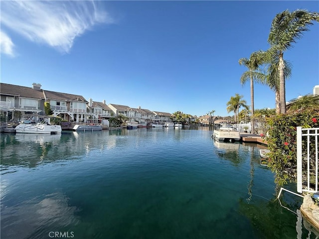 property view of water with a boat dock and a residential view