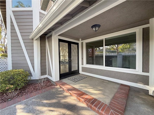 view of exterior entry featuring french doors