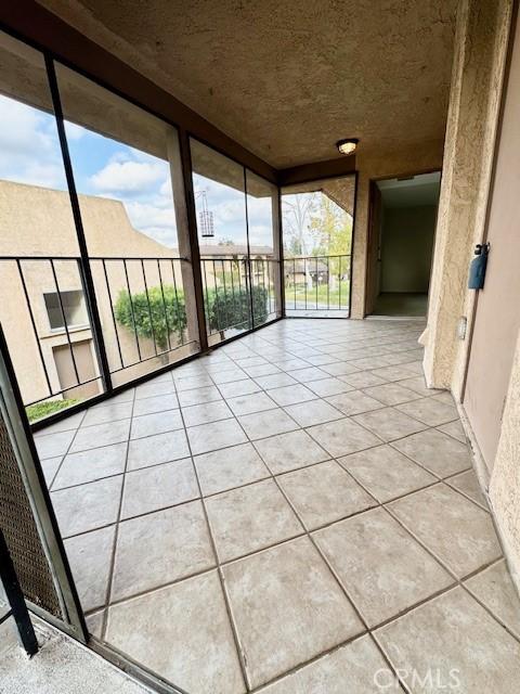 unfurnished sunroom with plenty of natural light