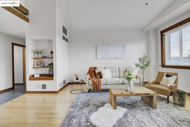 living room with light hardwood / wood-style flooring