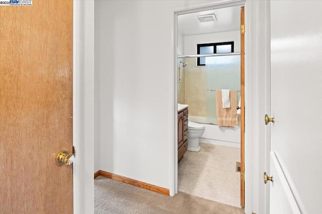 full bathroom featuring vanity, toilet, and combined bath / shower with glass door