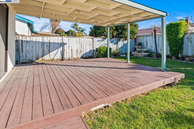 wooden deck with a yard