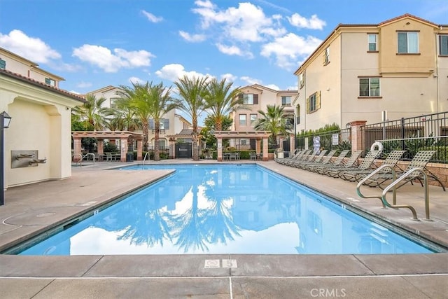 view of swimming pool with a pergola and a patio area