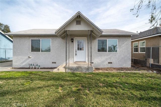 bungalow-style house with a front lawn