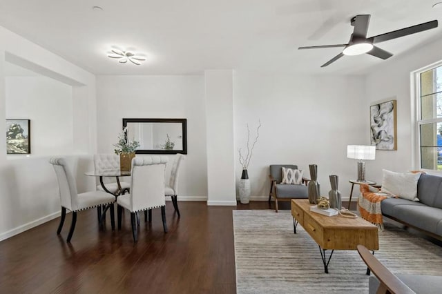 dining room with dark wood-type flooring and ceiling fan