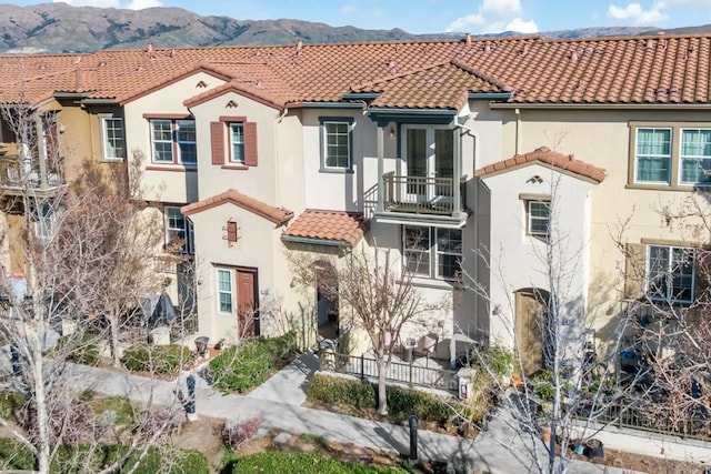 mediterranean / spanish-style house featuring a mountain view