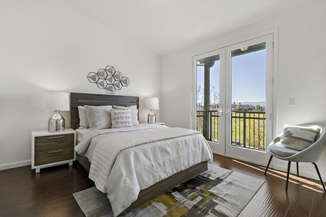 bedroom with dark wood-type flooring and access to exterior