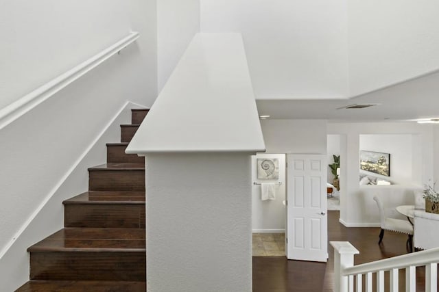 stairs with hardwood / wood-style floors