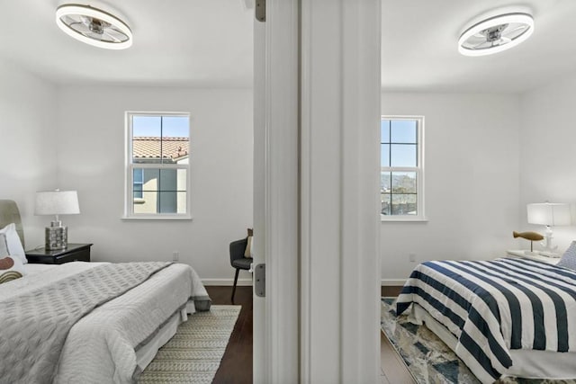 bedroom with dark hardwood / wood-style flooring