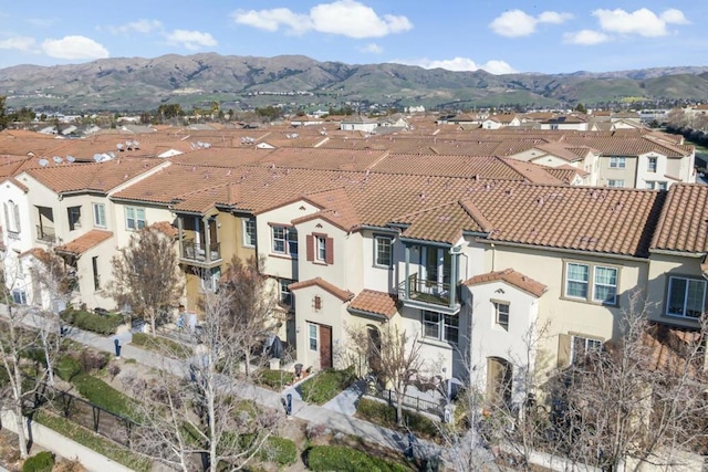 birds eye view of property featuring a mountain view