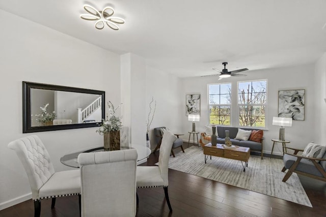 dining space featuring dark wood-type flooring and ceiling fan