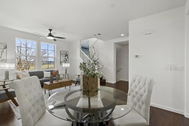 dining room with dark wood-type flooring and ceiling fan