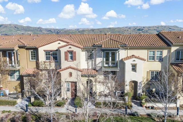 mediterranean / spanish home with a mountain view