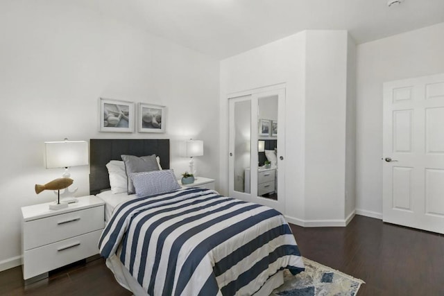 bedroom featuring dark hardwood / wood-style flooring