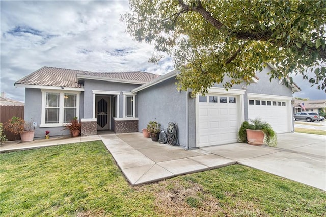 view of front of property featuring a garage and a front lawn