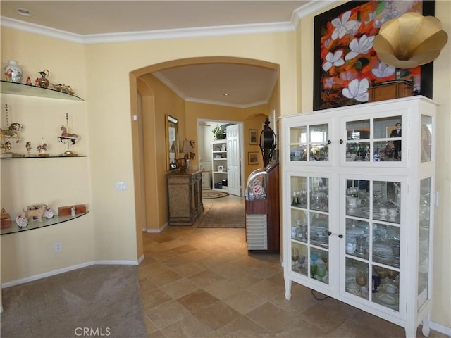 hallway featuring ornamental molding