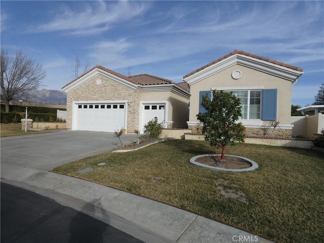 view of front of home with a garage and a front yard