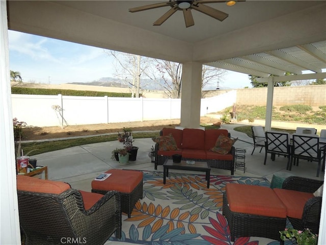 view of patio / terrace featuring an outdoor living space, a pergola, and ceiling fan