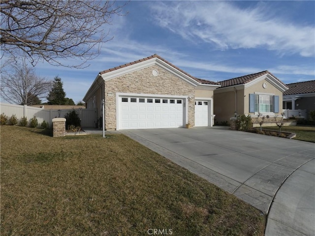 ranch-style house featuring a garage and a front yard