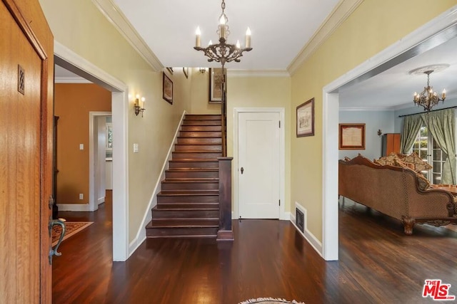 staircase featuring hardwood / wood-style flooring, ornamental molding, and a notable chandelier