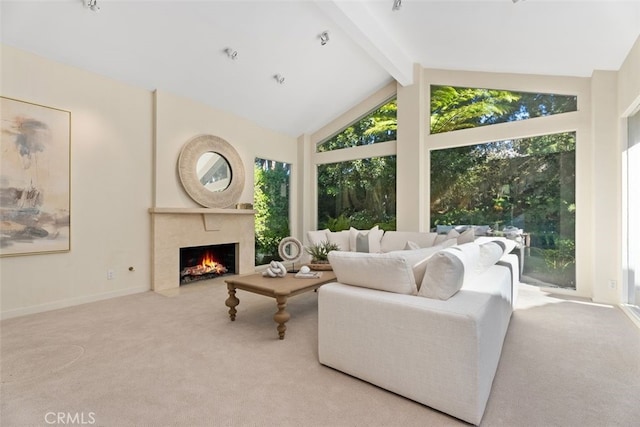 living room with high vaulted ceiling, beam ceiling, and light colored carpet