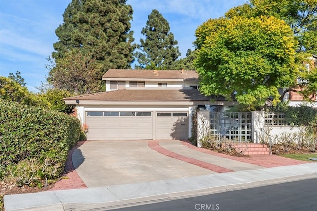 view of front of property with a garage