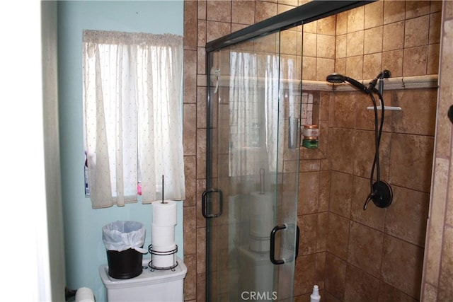 bathroom featuring an enclosed shower