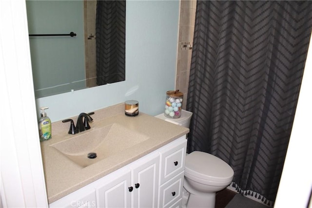 bathroom with vanity, a shower with curtain, and toilet