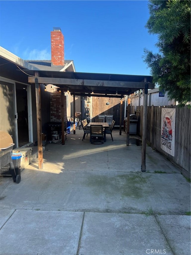 view of parking featuring an outdoor fire pit