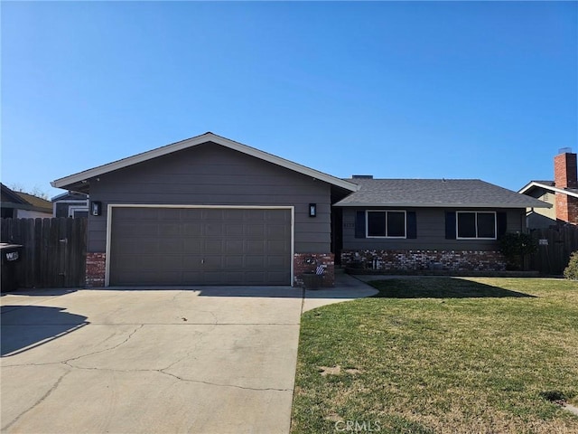 ranch-style house with a garage and a front lawn