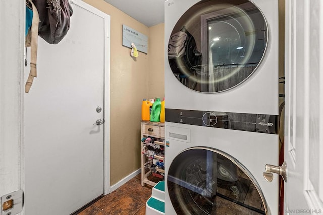 washroom with stacked washer and clothes dryer