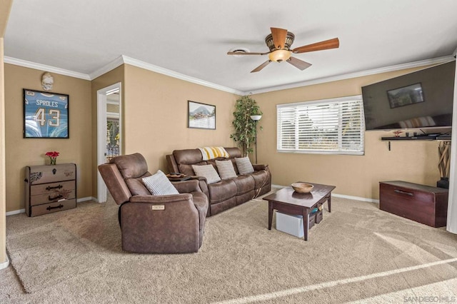 carpeted living room with crown molding and ceiling fan