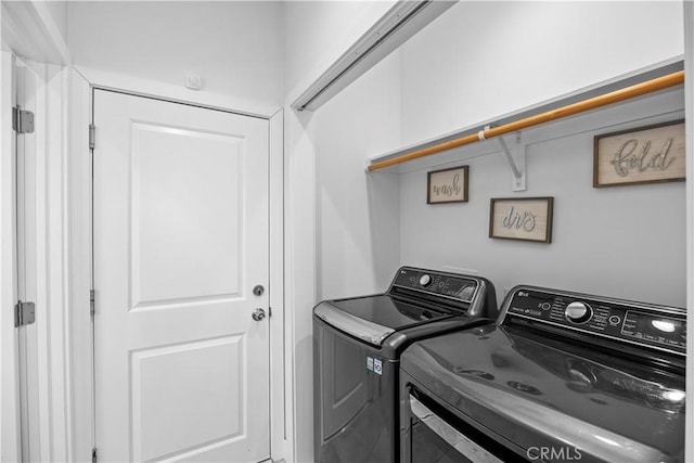 laundry area with washer and clothes dryer