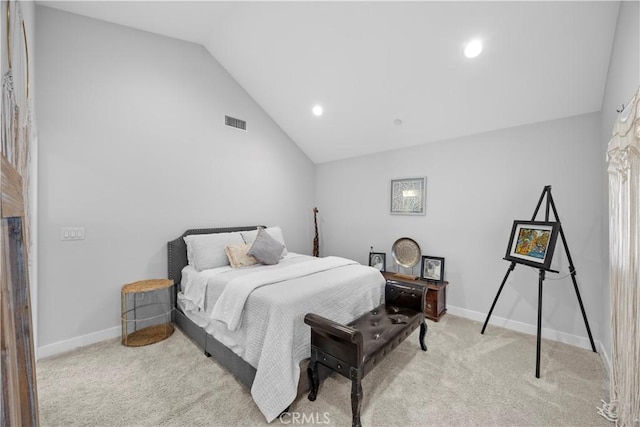 bedroom with lofted ceiling and light colored carpet