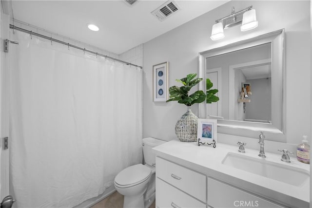 bathroom with vanity, tile patterned flooring, curtained shower, and toilet